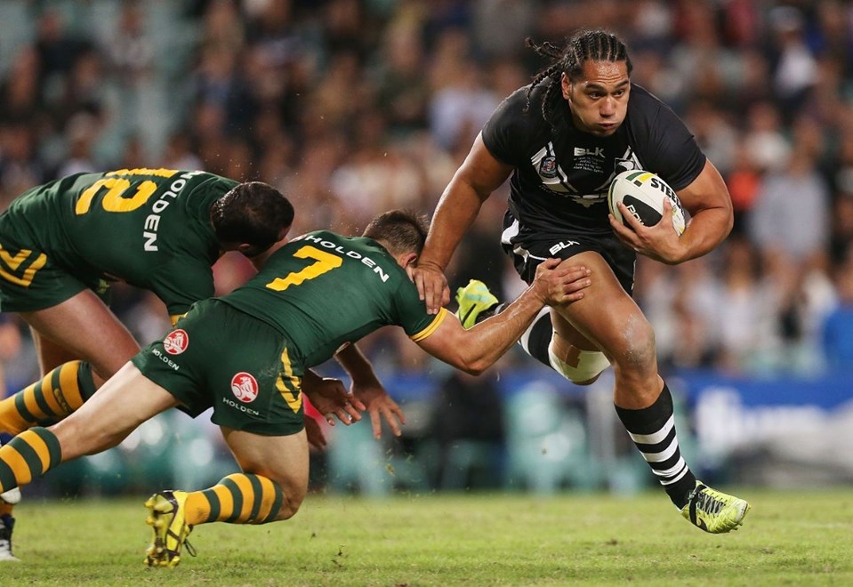 Martin Taupau of the Kiwis evades the tackle of Cooper Cronk and Boyd Cordner of the Kangaroos during the ANZAC Test between Australia and New Zealand at Allianz Stadium, Sydney, Australia on Friday 2 May 2014. Photo: Mark Metcalfe/www.photosport.co.nz
