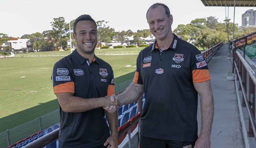 Wests Tigers halfback Luke Brooks and Head Coach Michael Maguire.