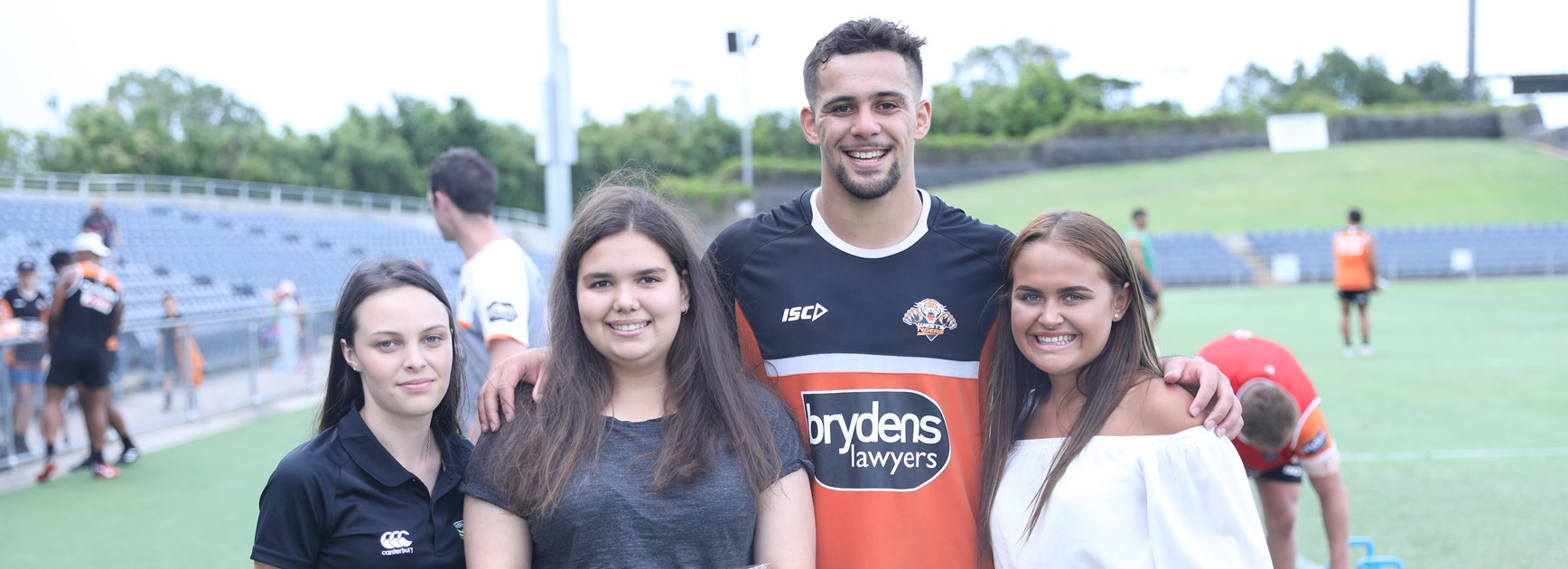 Wests Tigers forward Josh Aloiai with School2Work graduates.