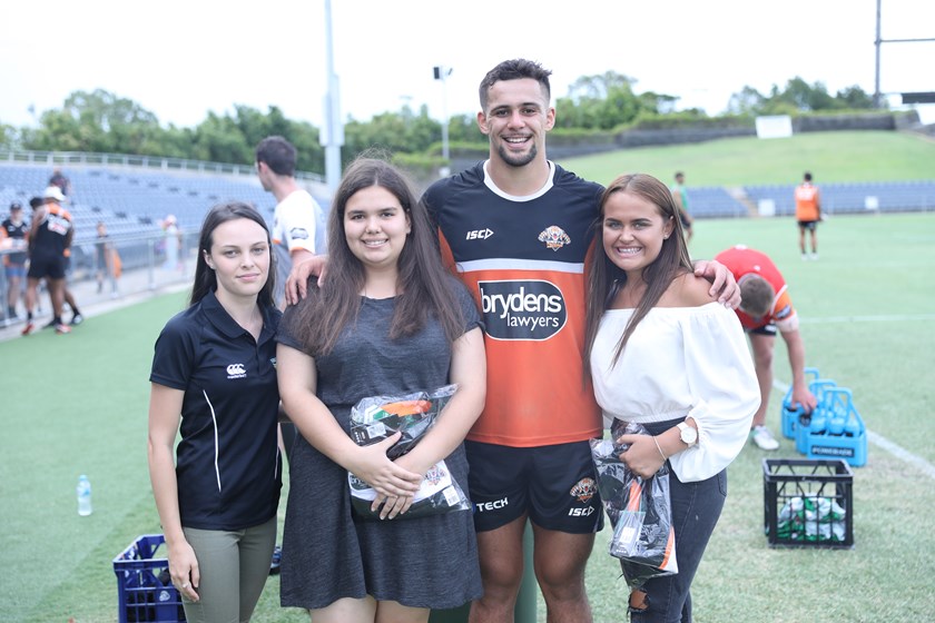 Wests Tigers forward Josh Aloiai with School2Work graduates.