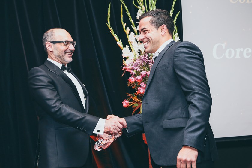 Corey Thompson is congratulated by Wests Tigers Major Sponsor Lee Hagipantelis from Brydens Lawyers