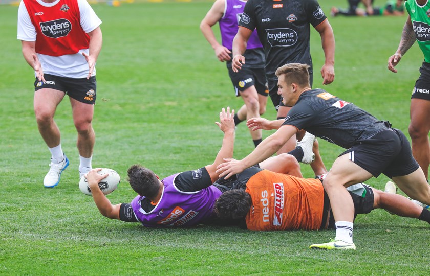 Luke Brooks takes on the line and reaches out to score at Wests Tigers training.