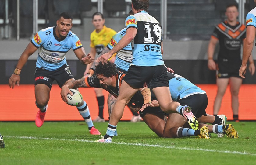 Wests Tigers forward Josh Aloiai scores a try against the Cronulla Sharks