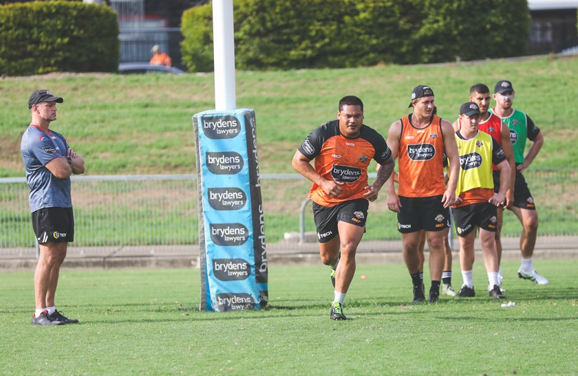 Coach Michael Maguire watches on as Joseph Leilua trains with Wests Tigers