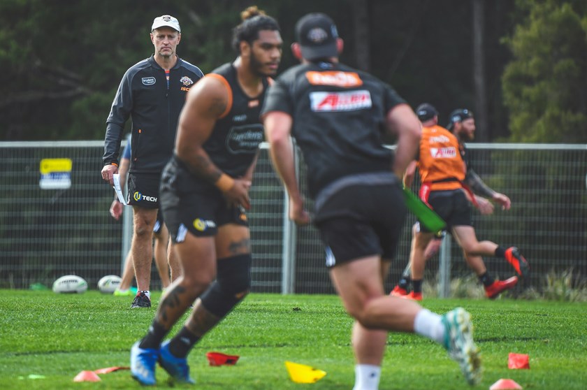 Wests Tigers Coach Michael Maguire watches on at training