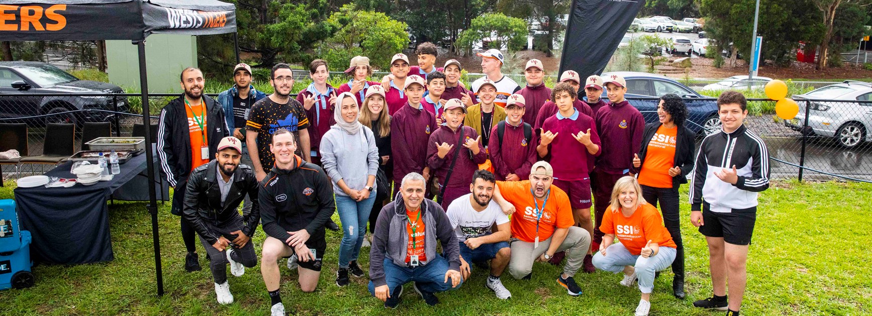Wests Tigers supporting Settlement Services International in Round 24