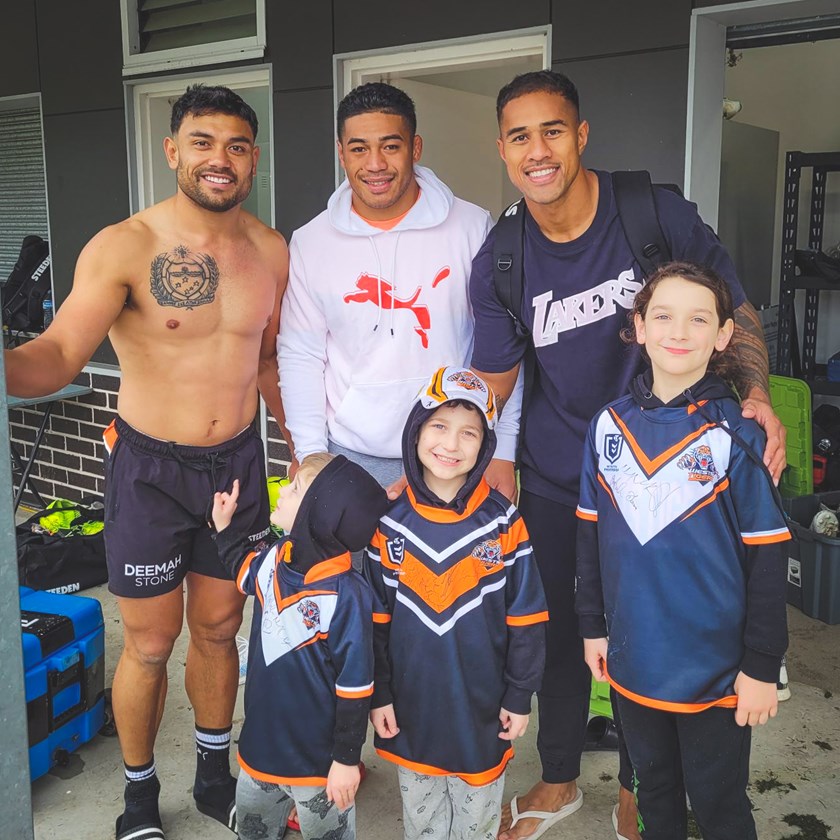 Wests Tigers players David Nofoaluma, Tom Amone, Michael Chee Kam, Archer and his family.