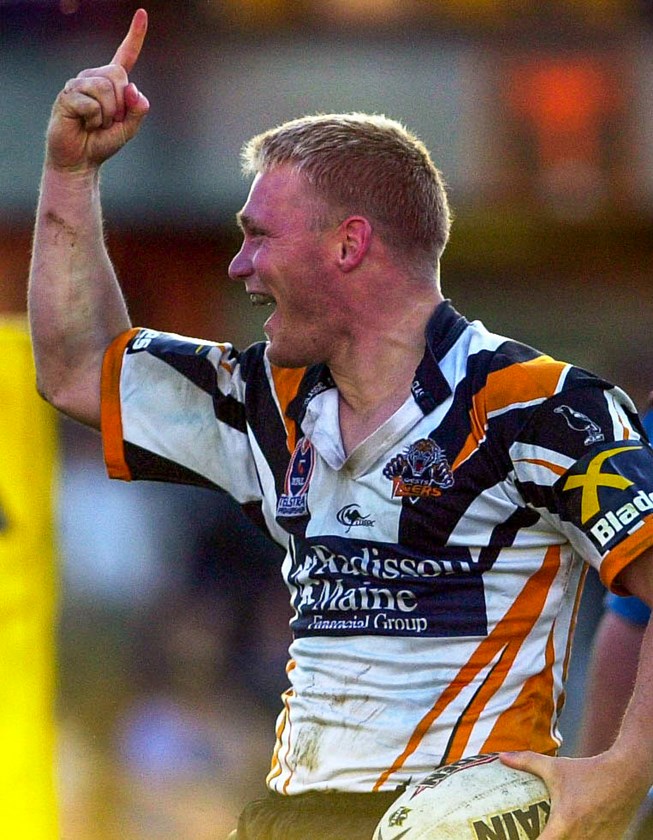 Robert Mears celebrates a try for Wests Tigers during his playing days.