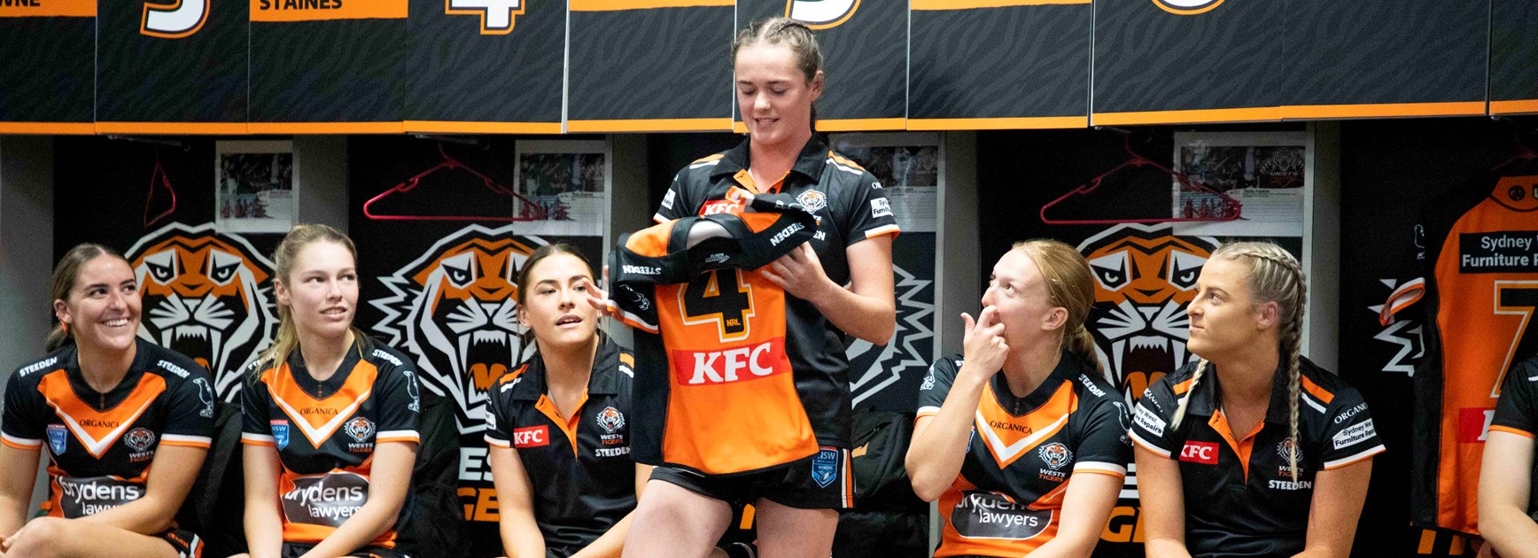 Tess Staines presented with her Wests Tigers HNW jersey 