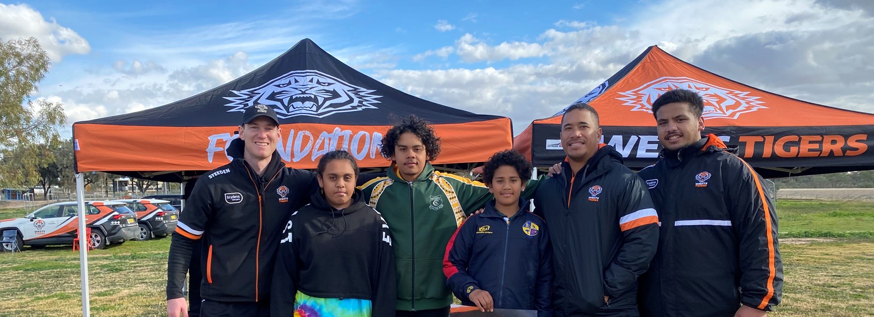 Wests Tigers staff with students from Menindee Central School