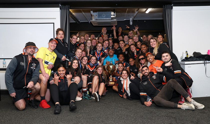 One happy family: Jess and team basking in glory after Grand Final win