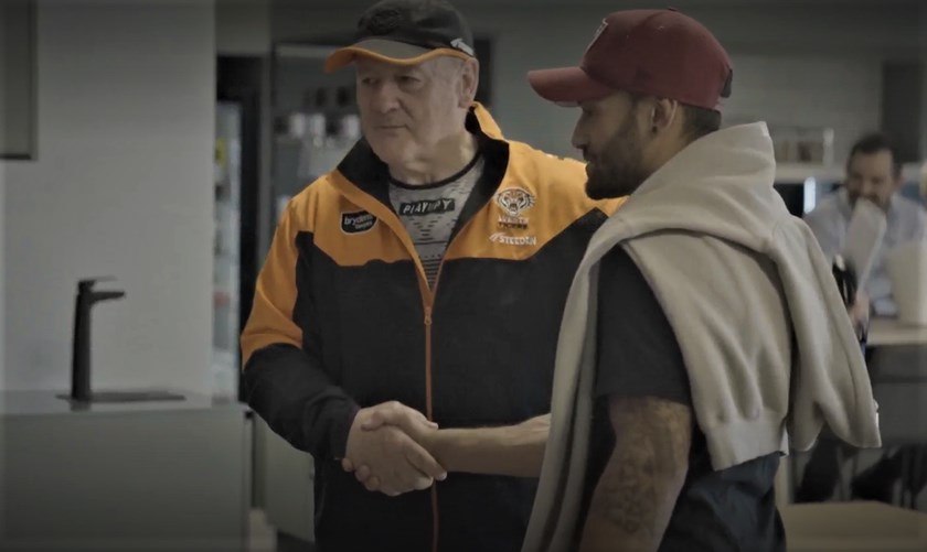 Coach Tim Sheens greets Api in the players' dining area at the Zurich Centre 