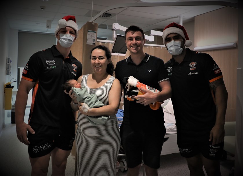 Alex and Joe handing out Christmas gifts at Campbelltown Hospital