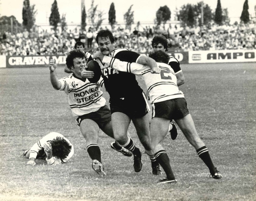 Bob Cooper vs Manly at Lidcombe Oval, putting Les Boyd and Tom Mooney under pressure.