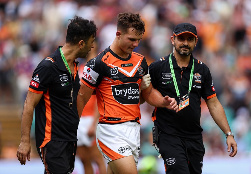 Jake Simpkin leaves the field after being knocked out against Knights 