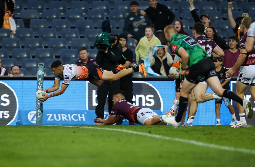 Staines soars through the air to score team's opening try against Sea Eagles