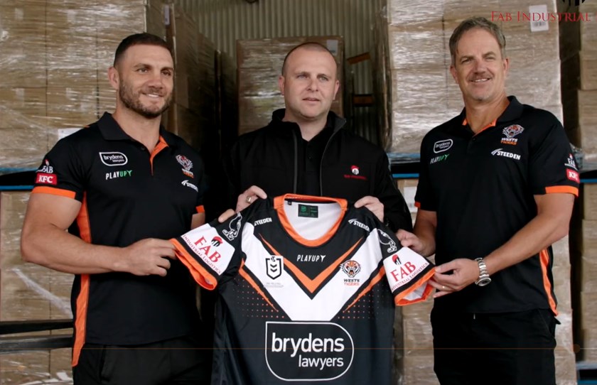 Neil Fabry with Wests Tigers CEO Justin Pascoe and Robbie Farrah