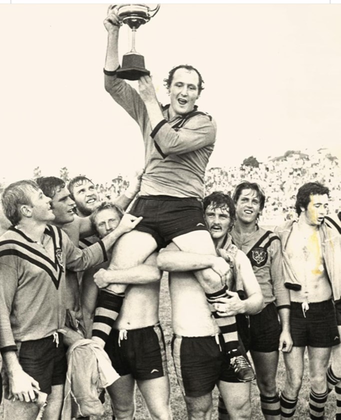 Brian Lockwood held aloft after winning the 1976 AMCO Cup