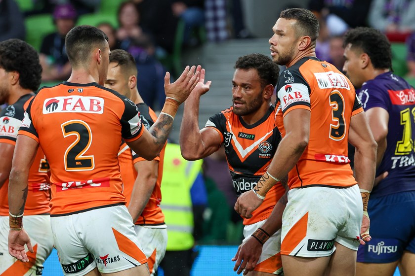 Api celebrates his first try for Wests Tigers