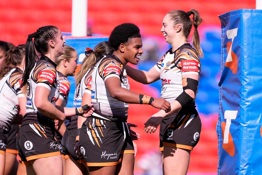Wests Tigers celebrate the try of five-eighth Losana Lutu against the Knights