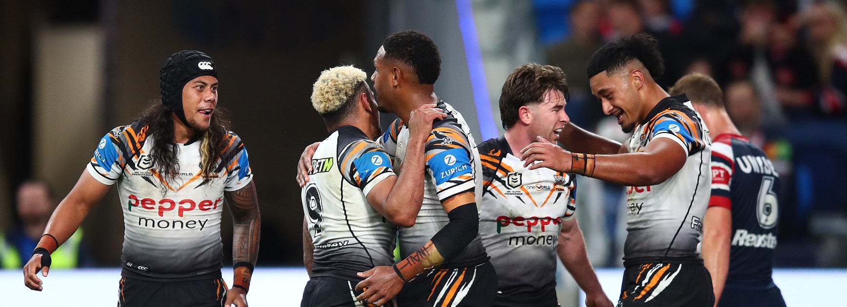 Happy times....Wests Tigers players celebrate against the Roosters 