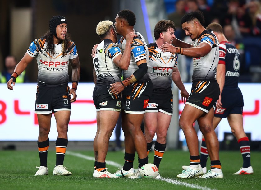Happy times....Wests Tigers players celebrate against the Roosters 
